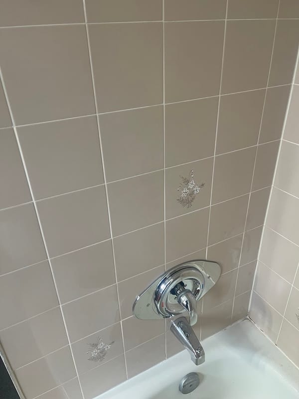 New single-handle shower valve installed on tiled wall